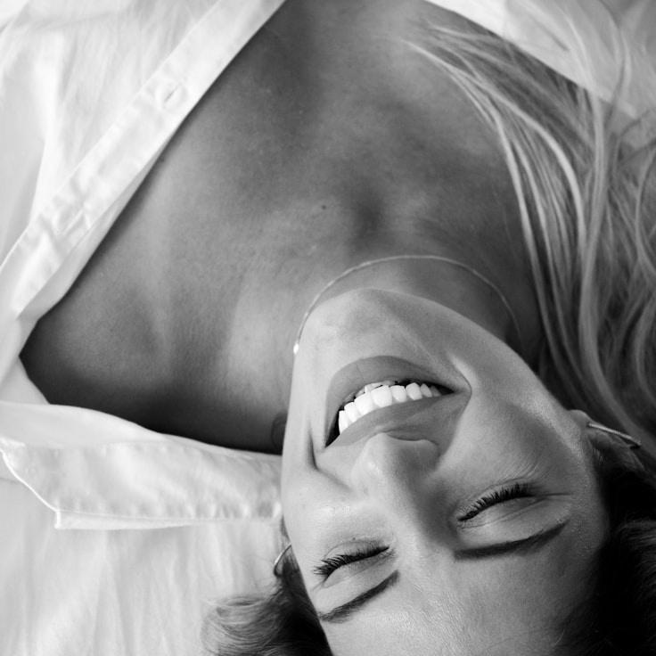 Alex Rivera, Lead Design Curator at CanvasCoreCanyon, reviewing corporate floral arrangements